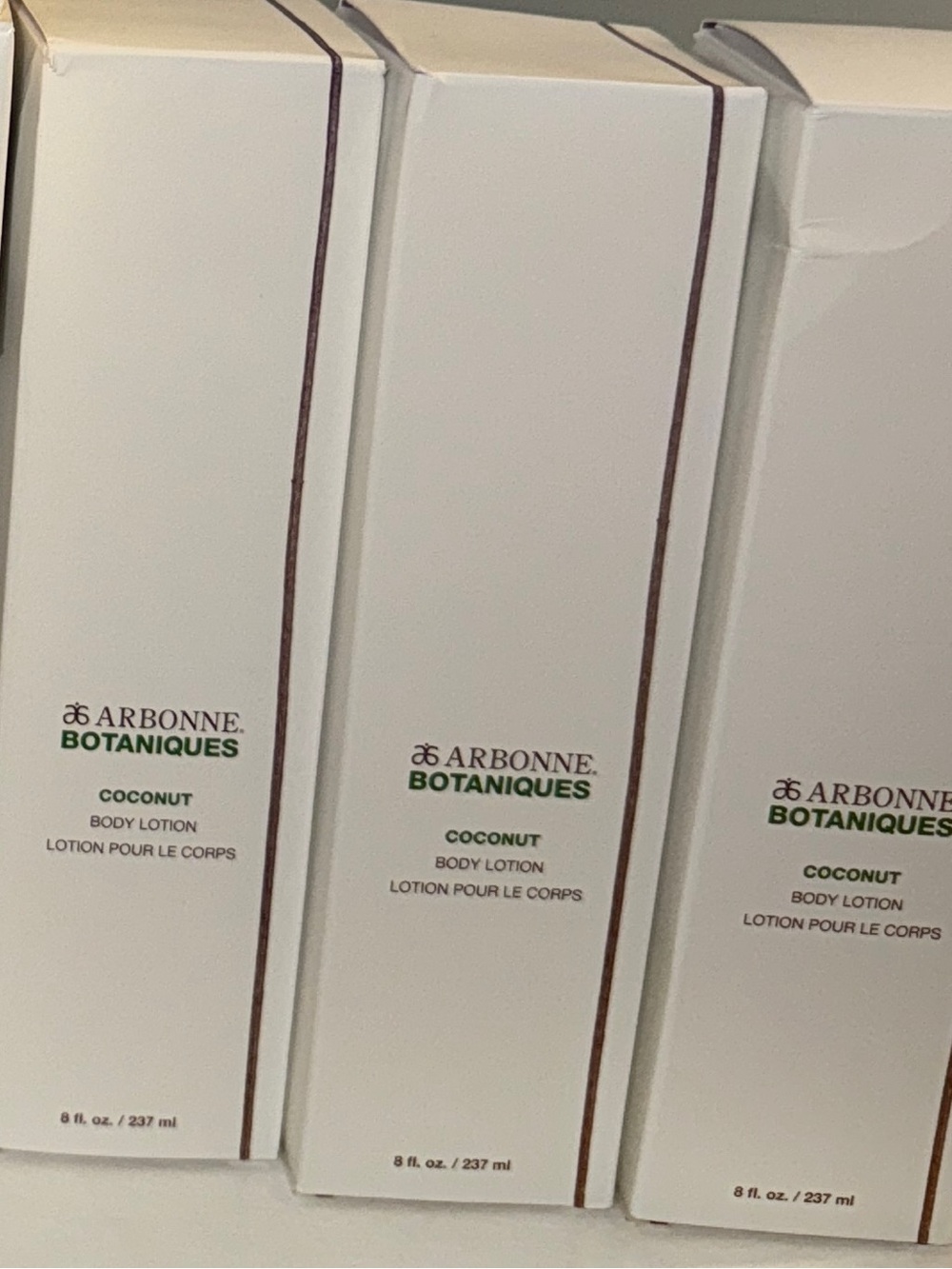 Arbonne Botanique Coconut Body Lotion — White with Green Accents